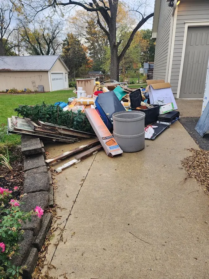 Dumpster being loaded with debris for 30 Yard Dumpster Rental in Uniontown